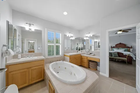 swimming pool view with a seating space