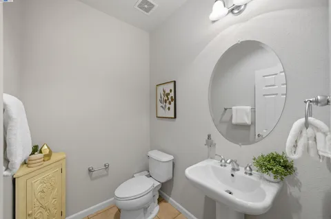 a view of a swimming pool with lounge chair in front of house