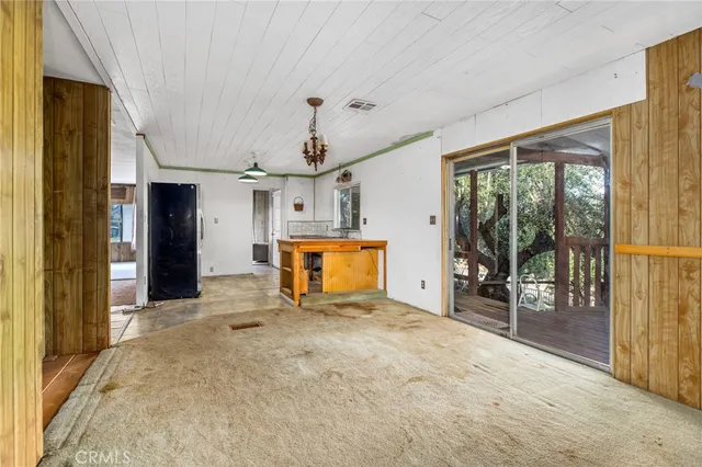 a dining room with a table and chairs