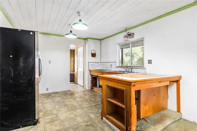 a bathroom with a tub a sink and a mirror
