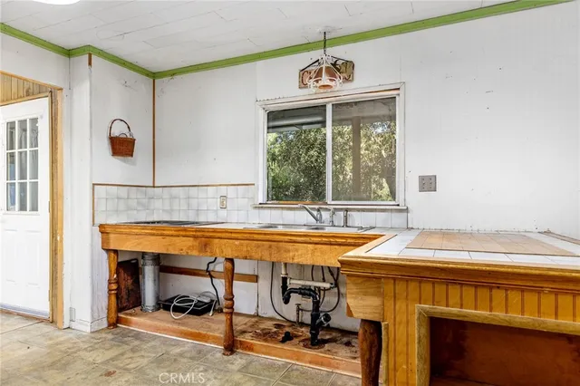 a view of a bathroom with a sink and a mirror
