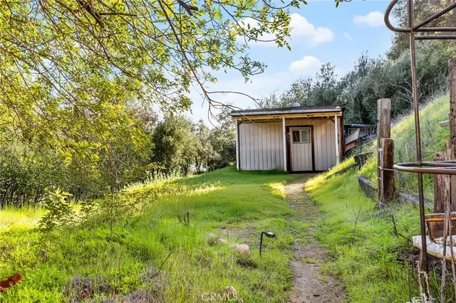 a front view of a house with yard and sitting area