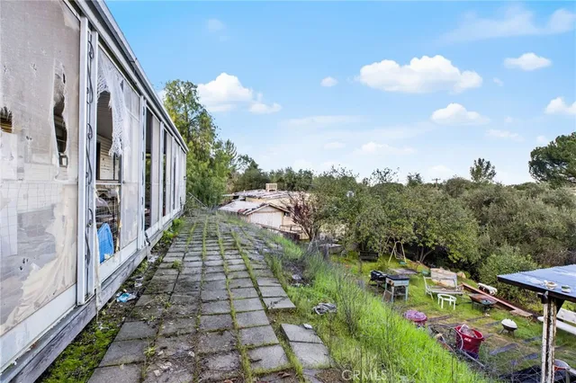 an aerial view of a house with a yard basket ball court