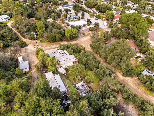 a view of a city with lush green forest