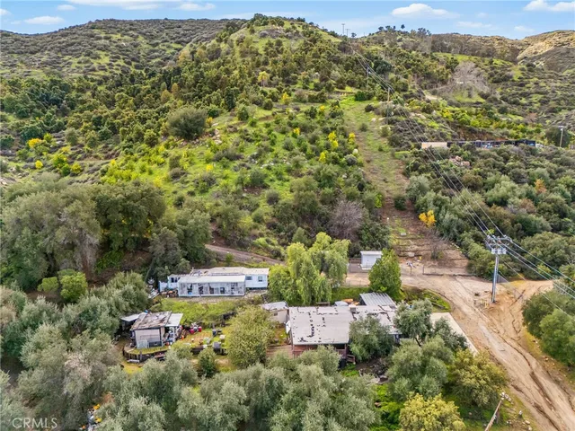 an aerial view of residential house with outdoor space