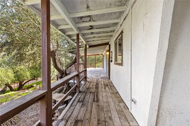 a view of balcony and wooden floor