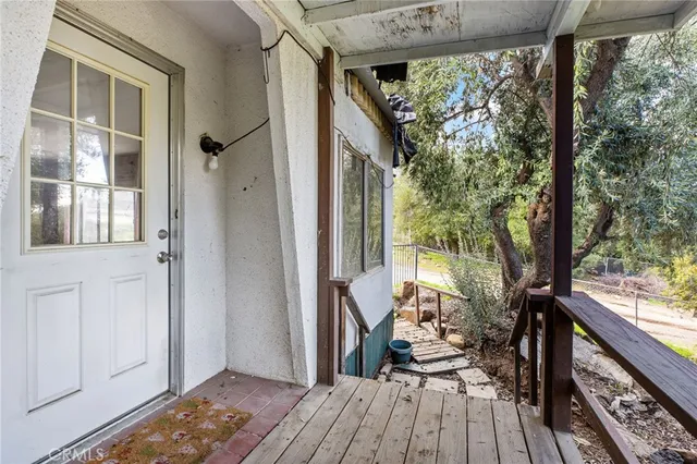 a view of a big room with windows and furniture