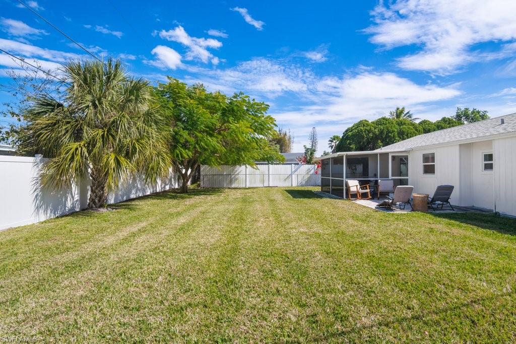 1207 Hernando Street Naples, FL 34103 - Photo 36 of 37 a view of a house with swimming pool and sitting area