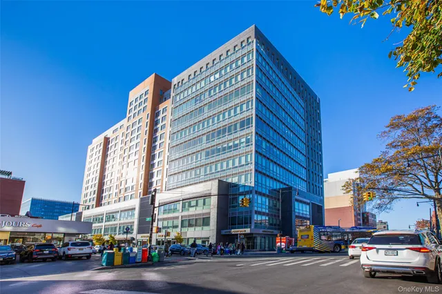 a city street lined with buildings and cars