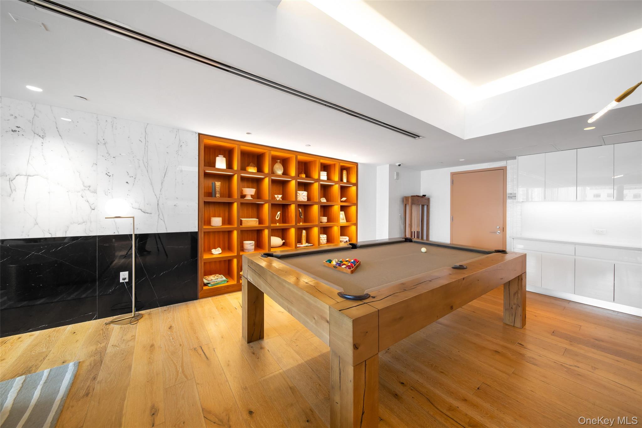 138-35 39th Avenue, Unit 17H Queens, NY 11354 - Photo 25 of 36 a kitchen with stainless steel appliances granite countertop a sink dishwasher and a stove with wooden floor