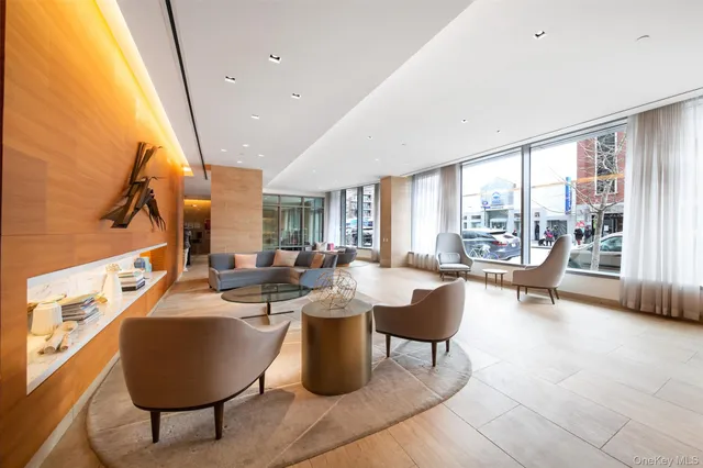 a lobby with furniture and window