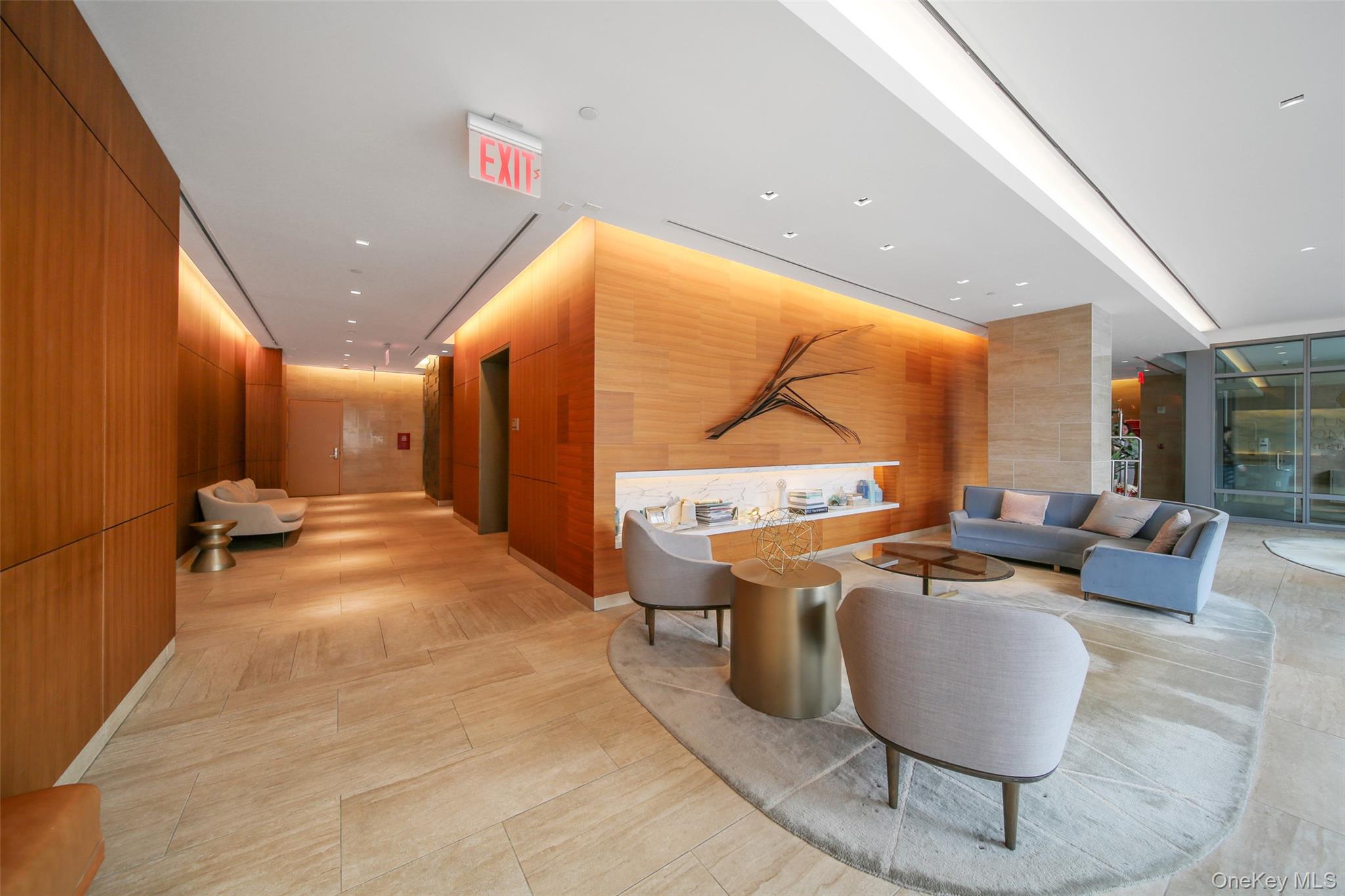138-35 39th Avenue, Unit 17H Queens, NY 11354 - Photo 29 of 36 a lobby with furniture and window