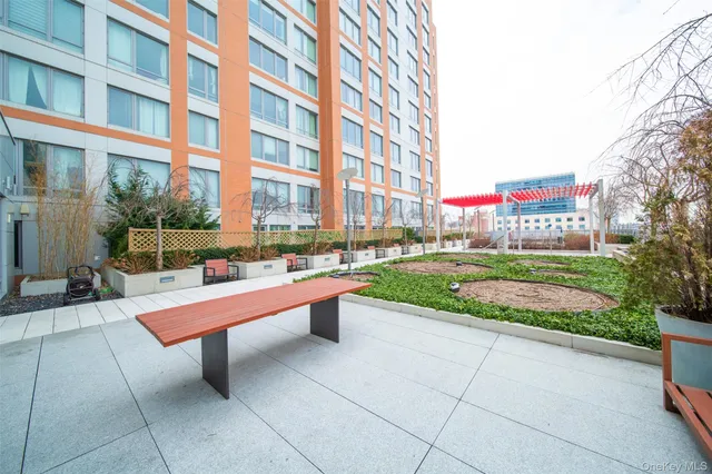 a view of a building with sitting area