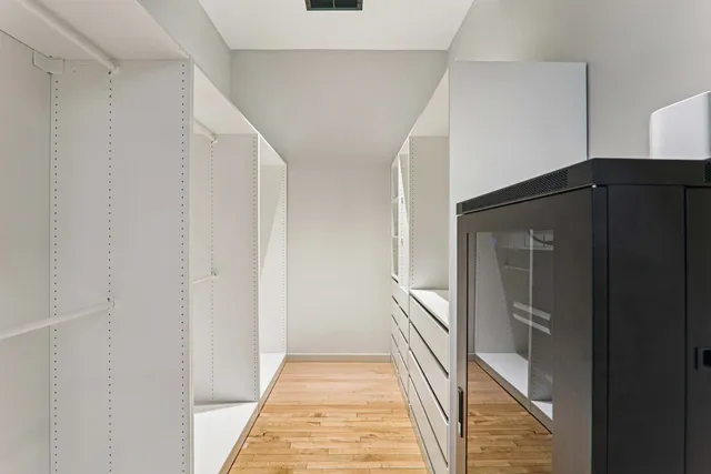 a bathroom with a shower sink and mirror
