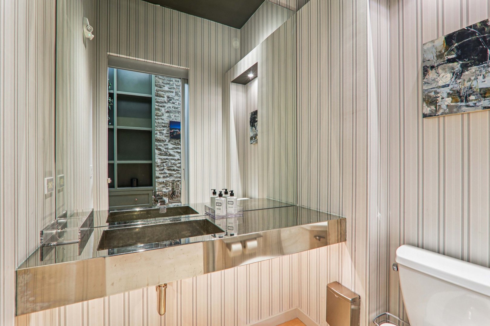 107 West Main Street, Unit 2 St. Charles, IL 60174 - Photo 15 of 32 a bathroom with a sink and a toilet