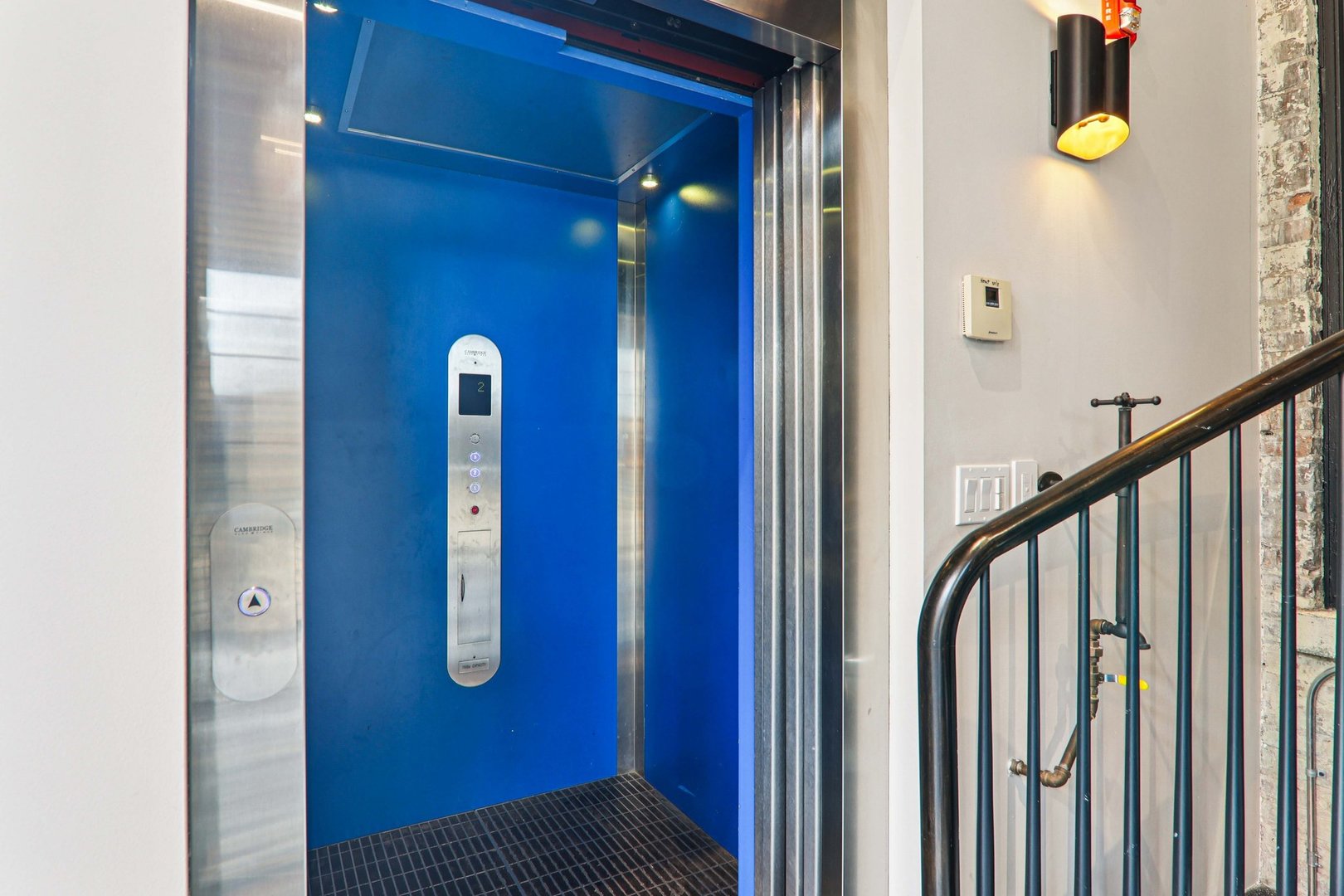 107 West Main Street, Unit 2 St. Charles, IL 60174 - Photo 2 of 32 a view of a hallway with wooden staircase