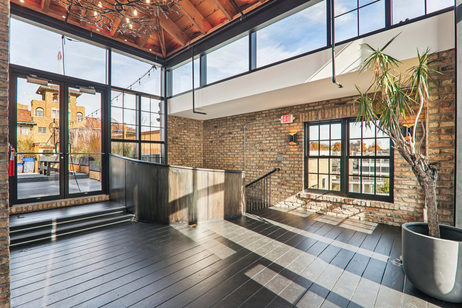 107 West Main Street, Unit 2 St. Charles, IL 60174 - Photo 23 of 32 a view of outdoor space with wooden floor and stairs
