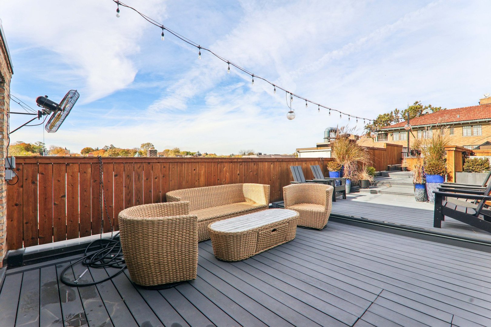 107 West Main Street, Unit 2 St. Charles, IL 60174 - Photo 25 of 32 a roof deck with couches and wooden floor