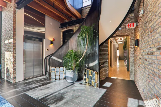 a living room with furniture windows and a chandelier