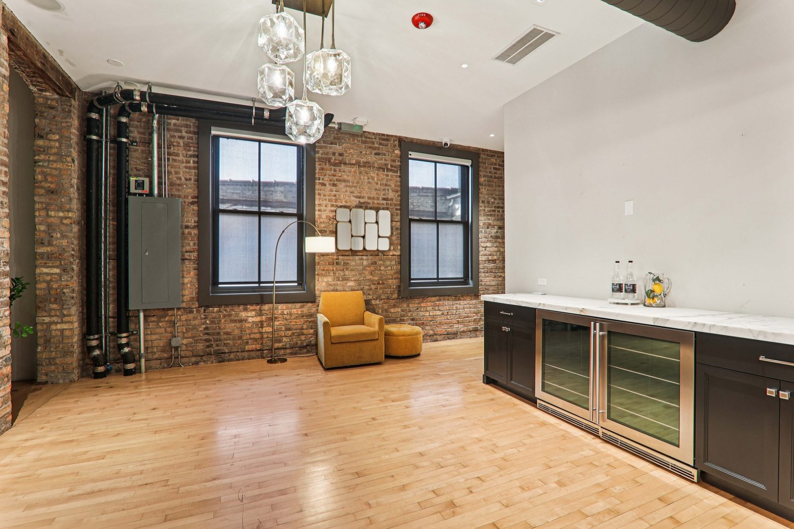 107 West Main Street, Unit 2 St. Charles, IL 60174 - Photo 9 of 32 a living room with furniture windows and a chandelier