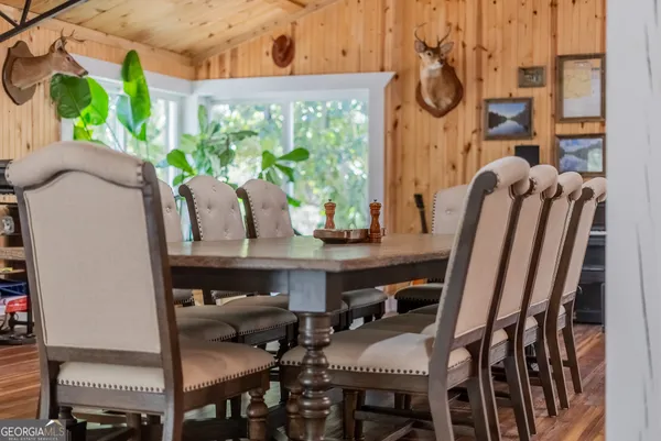 a view of table and chairs in patio