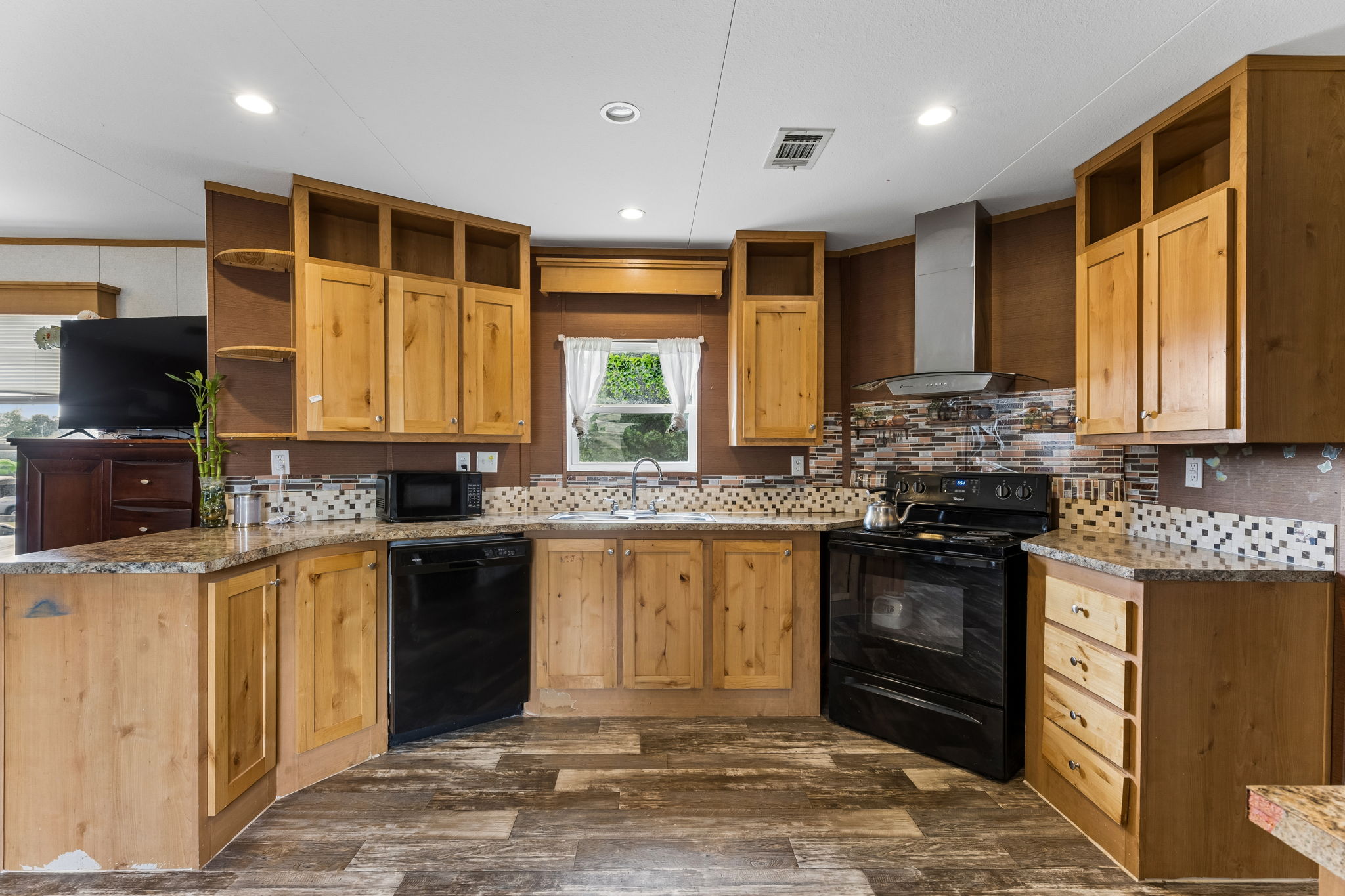 253 North County Line Road, Unit C Elgin, TX 78621 - Photo 10 of 39 A well-equipped kitchen boasts ample cabinetry and essential appliances.