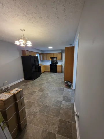 a room with a washing machine and a fireplace