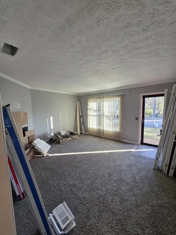 a bed room with a bed and a lamp