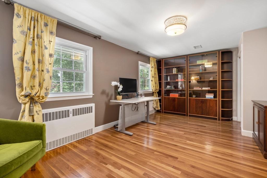 51 3 Ponds Road Wayland, MA 01778 - Photo 11 of 22 a kitchen with sink cabinets and wooden floor