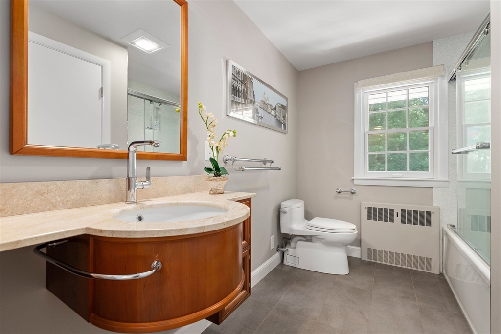 51 3 Ponds Road Wayland, MA 01778 - Photo 12 of 22 a bathroom with a sink toilet and a bathtub