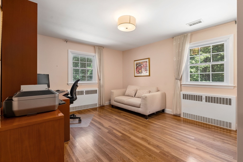51 3 Ponds Road Wayland, MA 01778 - Photo 13 of 22 a living room with furniture and a window