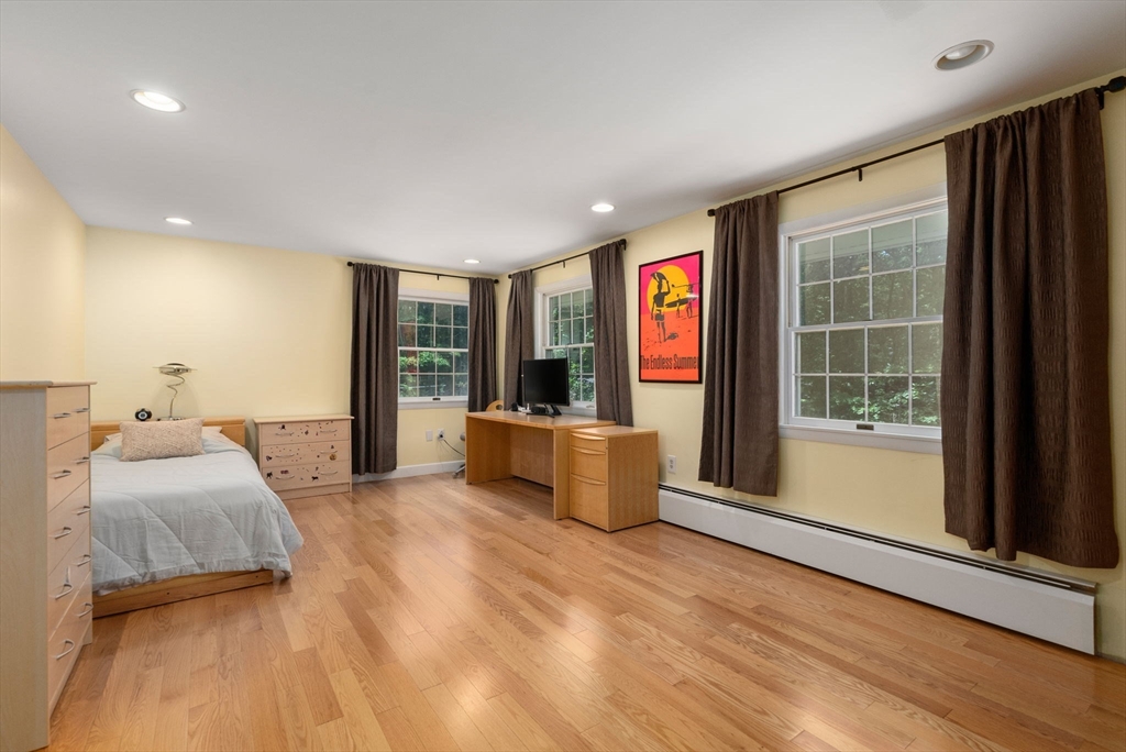 51 3 Ponds Road Wayland, MA 01778 - Photo 14 of 22 a bedroom with furniture and large window
