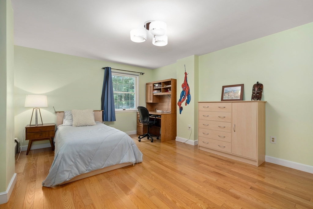 51 3 Ponds Road Wayland, MA 01778 - Photo 16 of 22 a bedroom with a bed and a view
