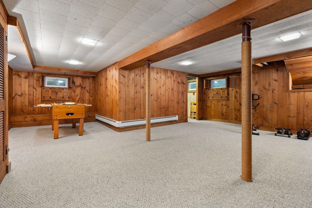 51 3 Ponds Road Wayland, MA 01778 - Photo 18 of 22 a view of a livingroom with gym equipment