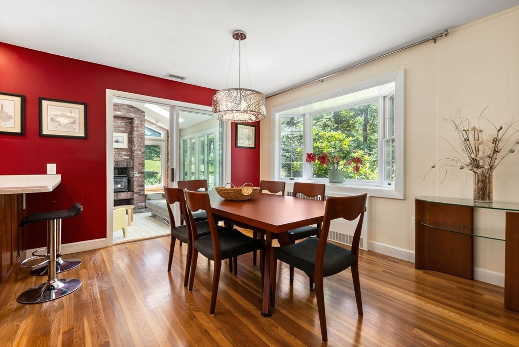 51 3 Ponds Road Wayland, MA 01778 - Photo 4 of 22 a view of a dining room with furniture window and wooden floor