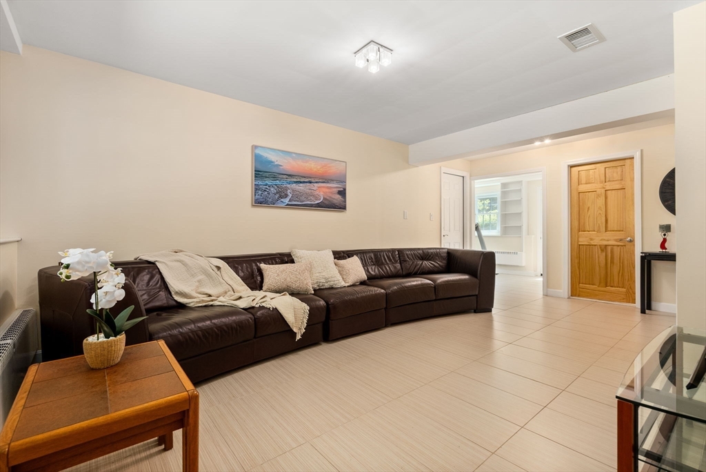 51 3 Ponds Road Wayland, MA 01778 - Photo 6 of 22 a living room with furniture