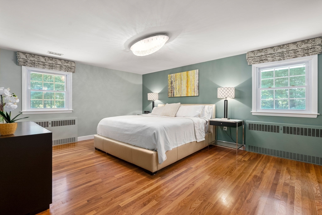 51 3 Ponds Road Wayland, MA 01778 - Photo 8 of 22 a bedroom with a bed and window