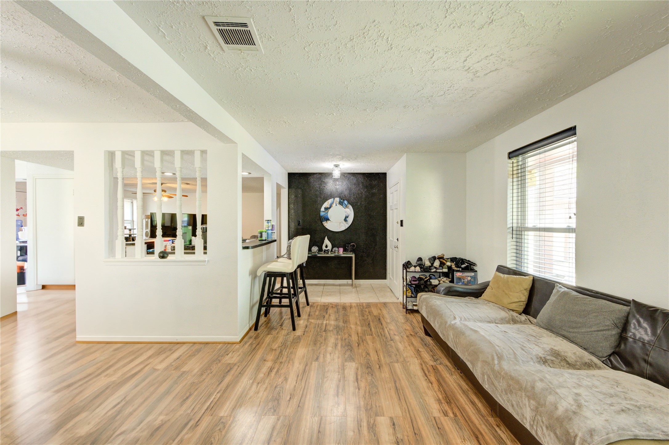 21014 Cimarron Parkway Katy, TX 77450 - Photo 13 of 21 a living room with furniture and wooden floor
