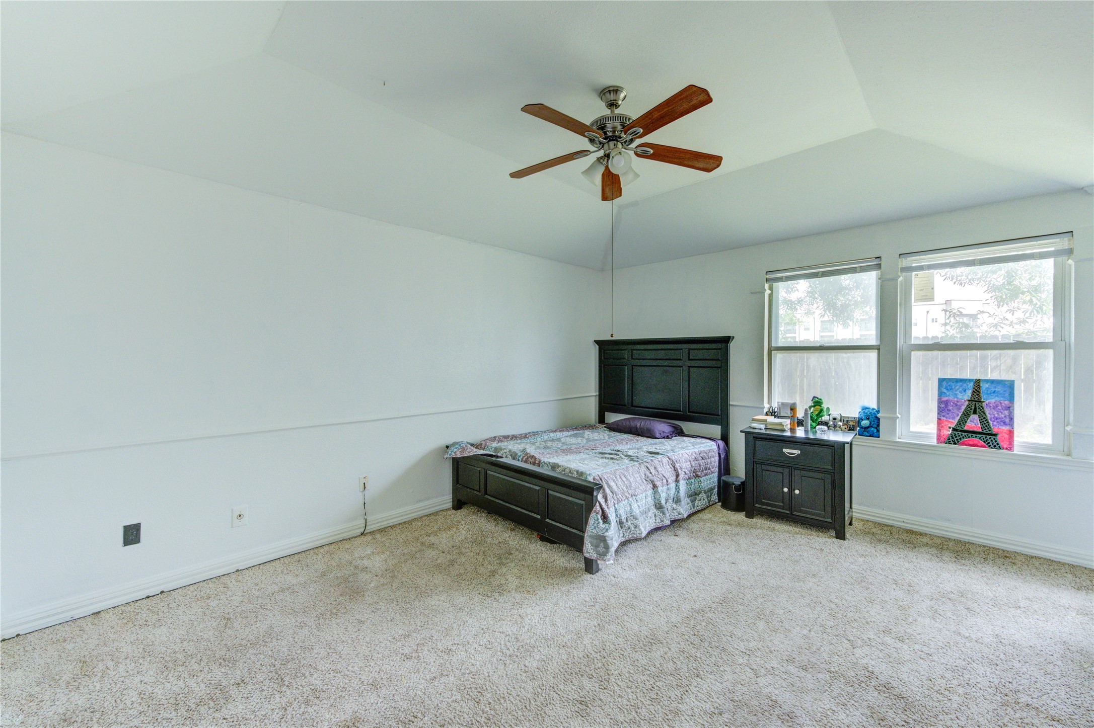 21014 Cimarron Parkway Katy, TX 77450 - Photo 15 of 21 a bedroom with a bed and a flat screen tv