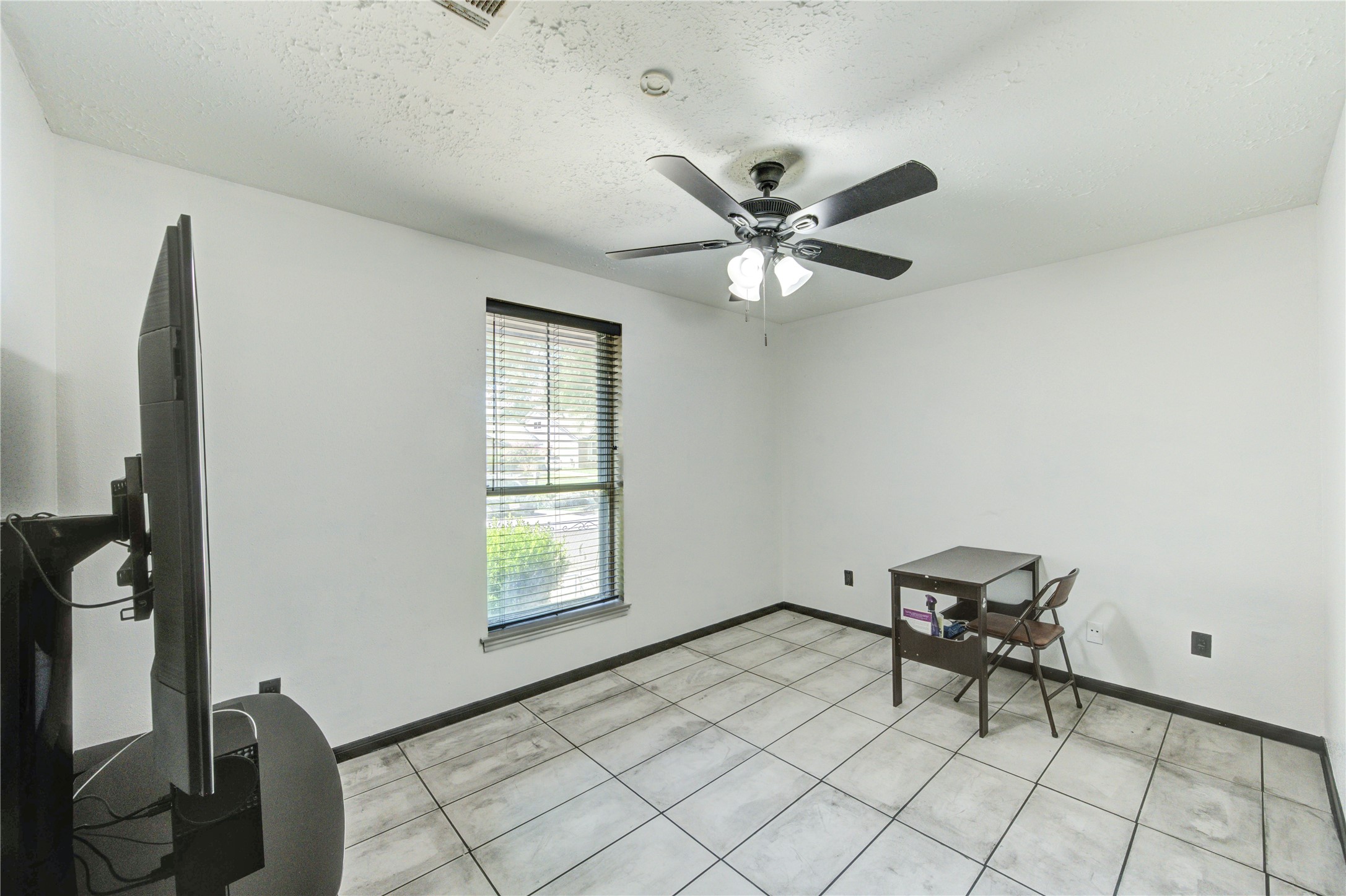 21014 Cimarron Parkway Katy, TX 77450 - Photo 19 of 21 a view of workspace with wooden floor and fan