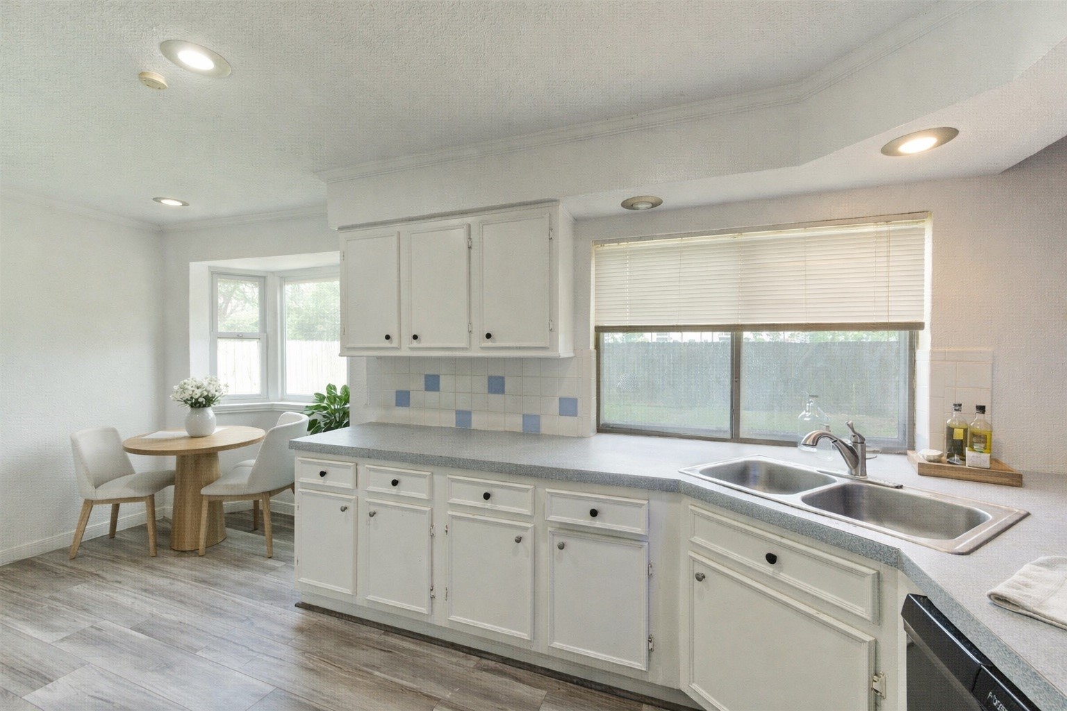 21014 Cimarron Parkway Katy, TX 77450 - Photo 7 of 21 a kitchen with a sink window and cabinets