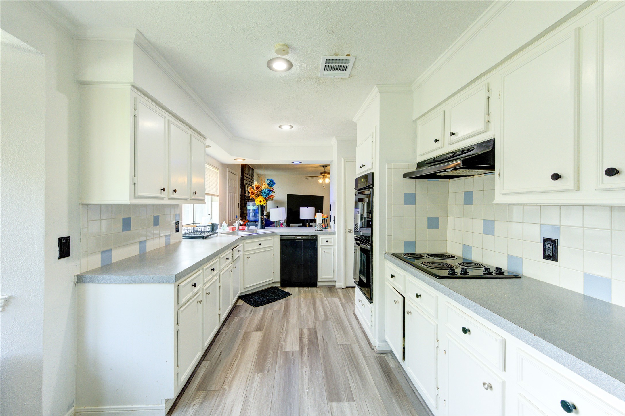 21014 Cimarron Parkway Katy, TX 77450 - Photo 10 of 21 a kitchen with granite countertop a sink stove and cabinets