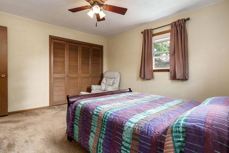 4853 Braewild Road Rockford, IL 61107 - Photo 24 of 46 a bedroom with a bed and a window