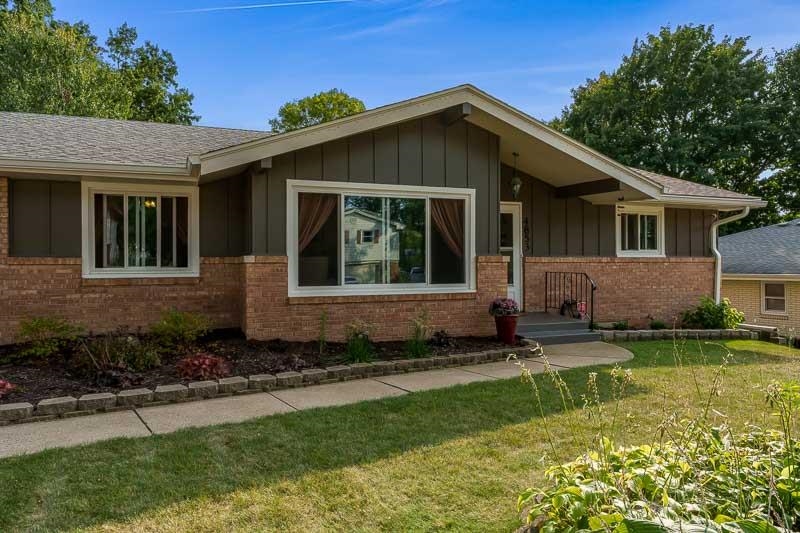 4853 Braewild Road Rockford, IL 61107 - Photo 3 of 46 a front view of a house with a yard