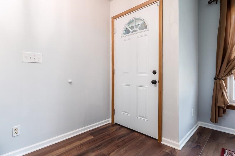 4853 Braewild Road Rockford, IL 61107 - Photo 4 of 46 a view of a hallway with wooden floor