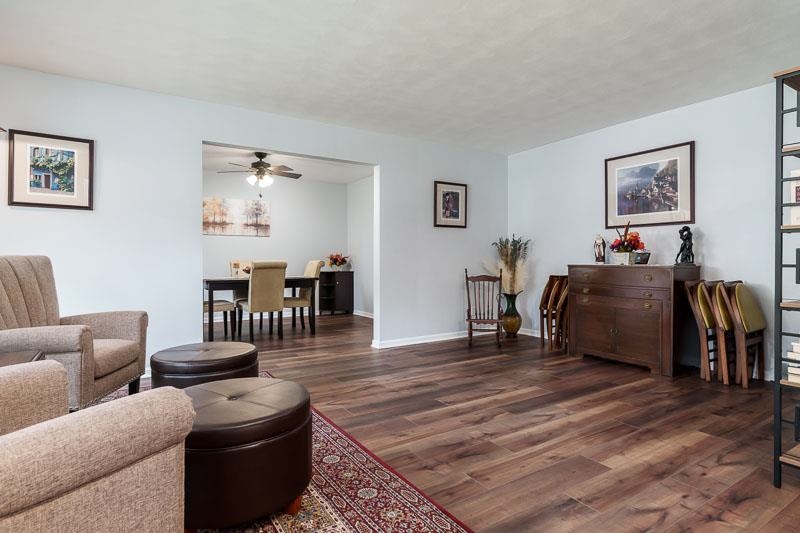 4853 Braewild Road Rockford, IL 61107 - Photo 5 of 46 a living room with furniture and wooden floor