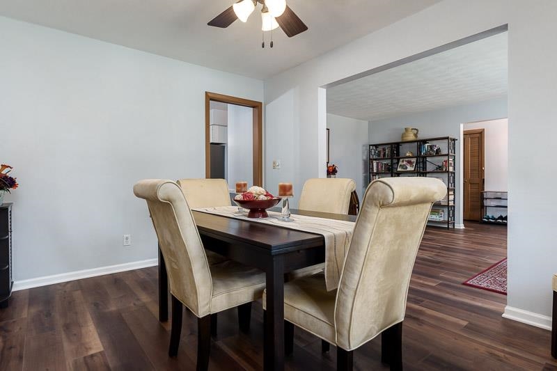 4853 Braewild Road Rockford, IL 61107 - Photo 8 of 46 a dining room with furniture and wooden floor