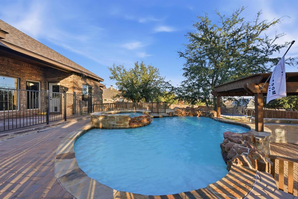 a view of a swimming pool with lounge chair