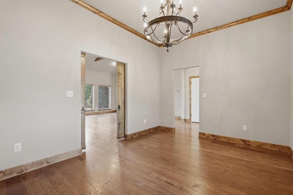 109 Benton Tuscola, TX 79562 - Photo 12 of 40 a view of empty room with wooden floor