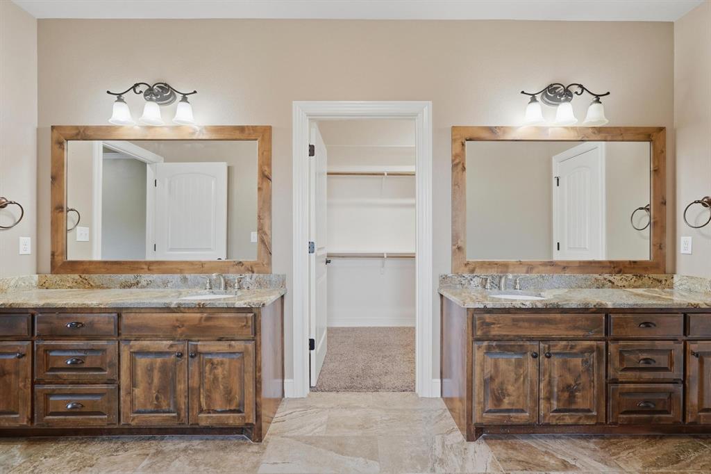 109 Benton Tuscola, TX 79562 - Photo 15 of 40 a bathroom with a sink and a mirror